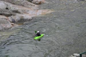 a person in a kayak in a river at Ponte Fontana in Campiglia Cervo