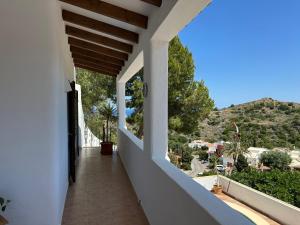 a balcony with a view of a mountain at ArteVida Andalusia FKK Nudist Holiday with yoga and massage in Mojácar