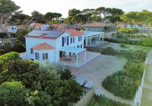 an aerial view of a white house with a yard at Exceptional Waterfront Villa in Hyères