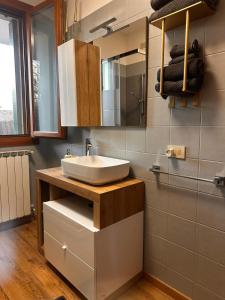 a bathroom with a sink and a mirror at Elite in Rovigo +17 photos