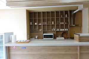 a kitchen with a counter with a microwave at Metekhi Stay - Old Tbilisi in Tbilisi City