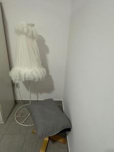 a corner of a room with a bed and a lamp at Austria 03 in Lebrija +6 photos