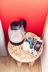 a tea pot sitting on top of a table at HOTEL RESTAURANT LA COTE REVEE in Leucate