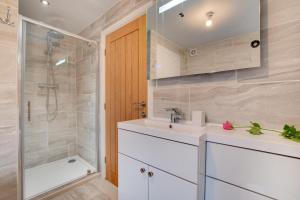 a bathroom with a sink and a shower at 5 Bed in Fryup Dale oc-wa291 in Danby +33 photos