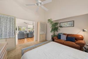 a bedroom with a bed and a couch at Lighthouse Lookout in Sanibel +64 photos