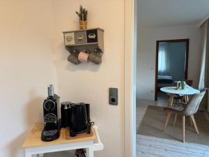 a room with a table with a camera on a wall at Sweet Escape in Bad Pyrmont +2 photos
