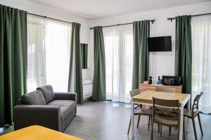 a living room with a couch and a table at Case Vacanze Marinella in Viverone
