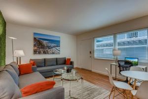a living room with a couch and a table at Walk To Beach 2BR Top Location - AA in San Clemente +42 photos