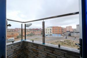 a view of a city street from a balcony at Riad Bollywood-Royal Stay C in Benguerir