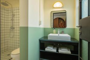 a bathroom with a sink and a mirror at Hotel San Fernando in Mexico City +98 photos