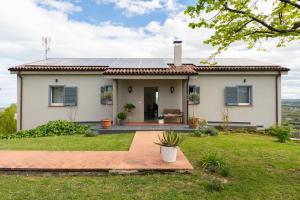 a house with solar panels on the roof at Marli Home in Corropoli