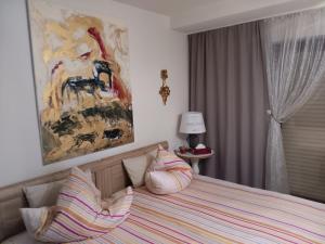 a bedroom with a bed with pillows on it at La Suite in Baden-Baden