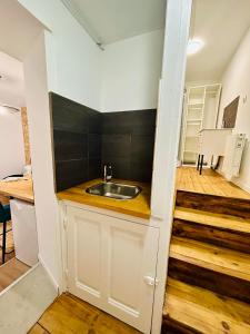 a kitchen with a sink and a counter top at Studio in Aurillac