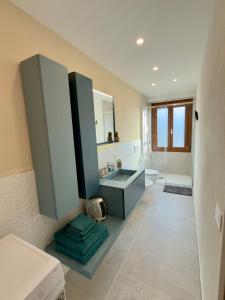 a bathroom with a sink and a mirror at Casa Alpea in Villadossola +16 photos