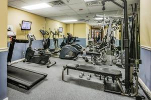 a gym with several treadmills and exercise machines at Harbour Beach Resort in Daytona Beach