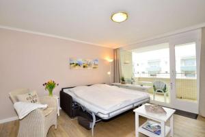 a hospital room with a bed and a window at Eydum, App 45 in Westerland +13 photos