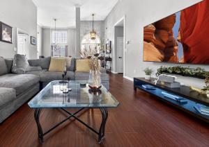 a living room with a couch and a table at The Executive Suite in McDonough