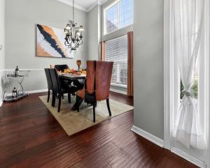 a dining room with a table and chairs at The Executive Suite in McDonough +10 photos