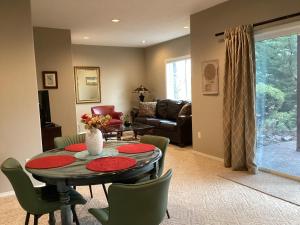 a living room with a table and chairs at Five Oaks Retreat in Salem