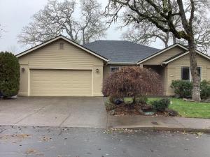 a house with a garage in a yard at Five Oaks Retreat in Salem