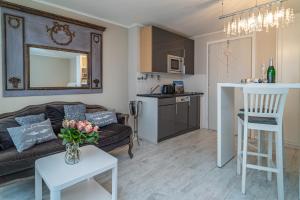 a living room with a couch and a table at Andreas-Dirks-Straße 1, App 505 "Pralinchen" in Westerland