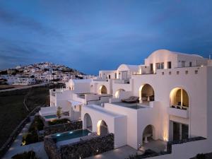a view of a white house at night at Ark in Pyrgos