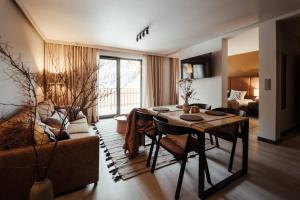 a living room with a table and a couch at Leśniczanka in Brenna +91 photos