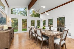 a dining room with a wooden table and chairs at Abode at Alpine Retreat in Wilson