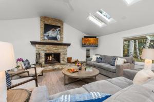 a living room with a couch and a fireplace at Abode at Alpine Retreat in Wilson