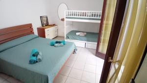 a bedroom with two beds and a bunk bed at terrazza acquaviva in Marittima