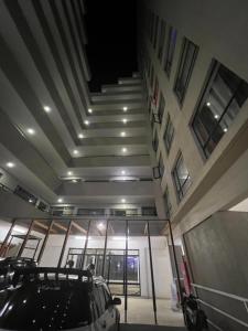 a parking lot with cars parked in front of a building at T-Homes in Nairobi