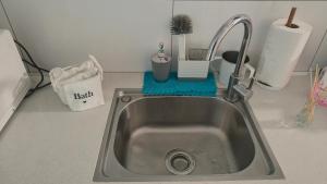 a kitchen sink with a faucet on a counter at נופש חלומי בכנרת in Tiberias +19 photos