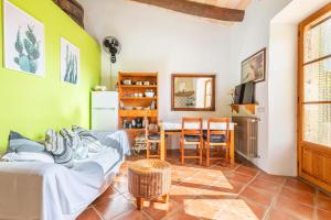 a living room with a couch and a table at Agroturismo Sa Vall by MHR in Son Macia +54 photos