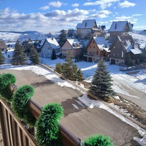 an aerial view of a town in the snow at Apartman Montis in Kupres
