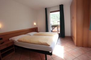 Postel nebo postele na pokoji v ubytování Hotel Miramonti