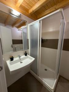 a bathroom with a sink and a shower at A Casa de Feli in Muros +19 photos