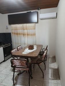 a dining room table and chairs in a room at Alojamiento Fiara in Chajarí +8 photos