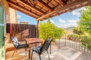 a patio with a table and chairs and a fence at Agroturismo Sa Vall by MHR in Son Macia