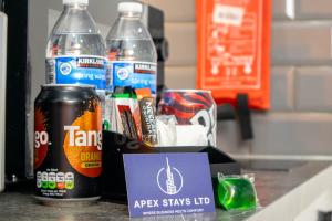 a counter with two soda bottles on a counter top at Studio Close To Alhambra And Bradford Live Walk To Stations in Bradford