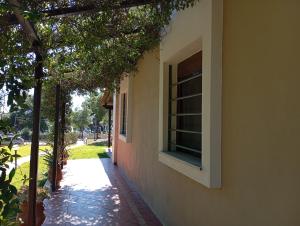 a window on the side of a building at High aesthetics maisonette in the wood by the sea in Metamorfosi