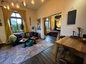 a living room with a couch and a table at Boutique Apartment Benz 3 in Bergisch Gladbach