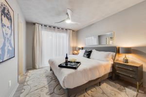 a bedroom with a large bed and a window at Stylish Dallas Condo Resort-Style Pool in Dallas +57 photos