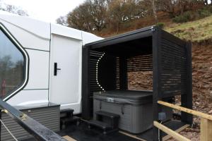 an open door of an rv with a grill at Galactic getaways PLUTO in Prestatyn