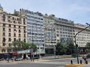 a large building on the corner of a street at C&MHouse in Buenos Aires