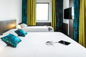 Postel nebo postele na pokoji v ubytování Ibis Styles Lyon Centre - Gare Part Dieu