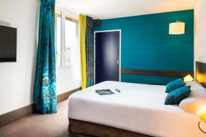 Postel nebo postele na pokoji v ubytování Ibis Styles Lyon Centre - Gare Part Dieu