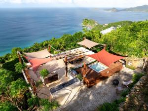 an aerial view of a house with a view of the ocean at Villa Odyssea BVI in Tortola Island