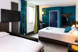 Postel nebo postele na pokoji v ubytování Ibis Styles Lyon Centre - Gare Part Dieu
