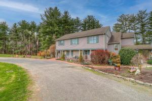 a house on a street with a driveway at Paper Mill Pines Bed and Breakfast in Shickshinny