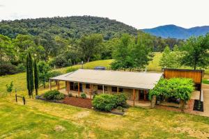 an aerial view of a house in a field at Buffalo Bliss in Porepunkah